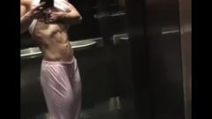 Fantastic Blonde Muscle Woman Admires Herself In Elevator Mirror